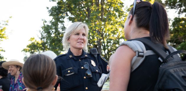 Officer talking to neighbors
