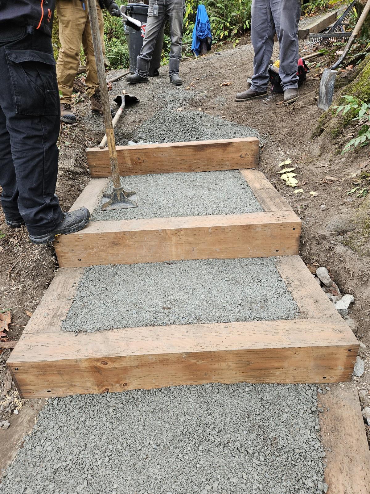 Setting a packed gravel surface into the new stair steps