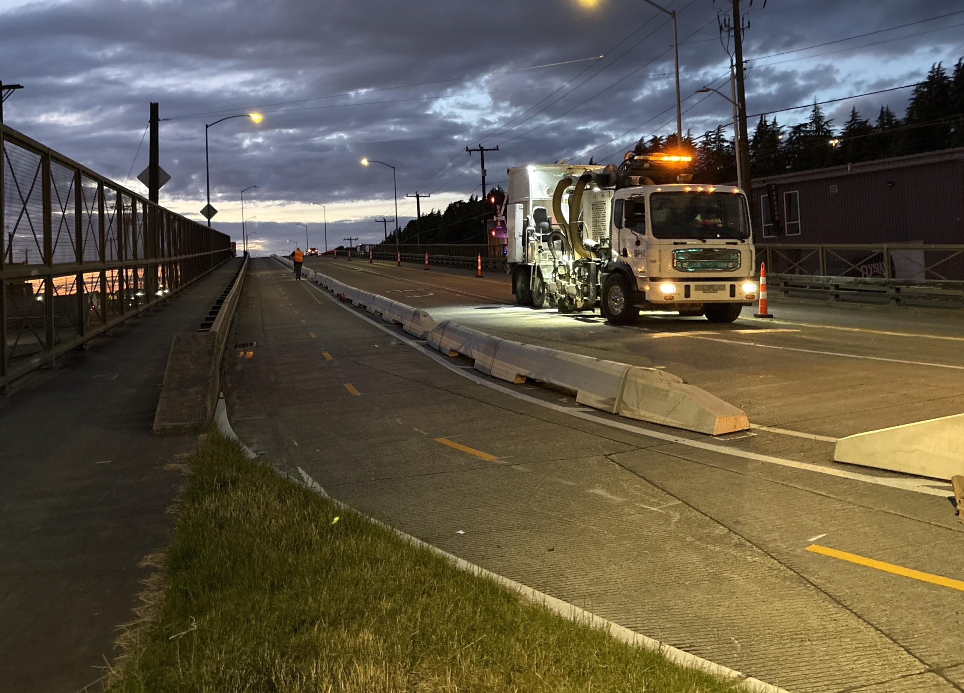 Photo showing striping installation on Airport Way S looking north from S Lucile St.