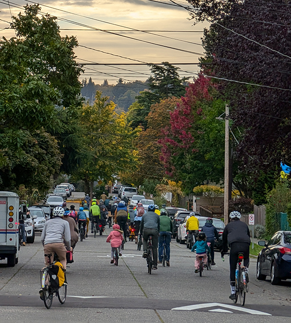 Kids and adults biking on the 6th Ave Greenway