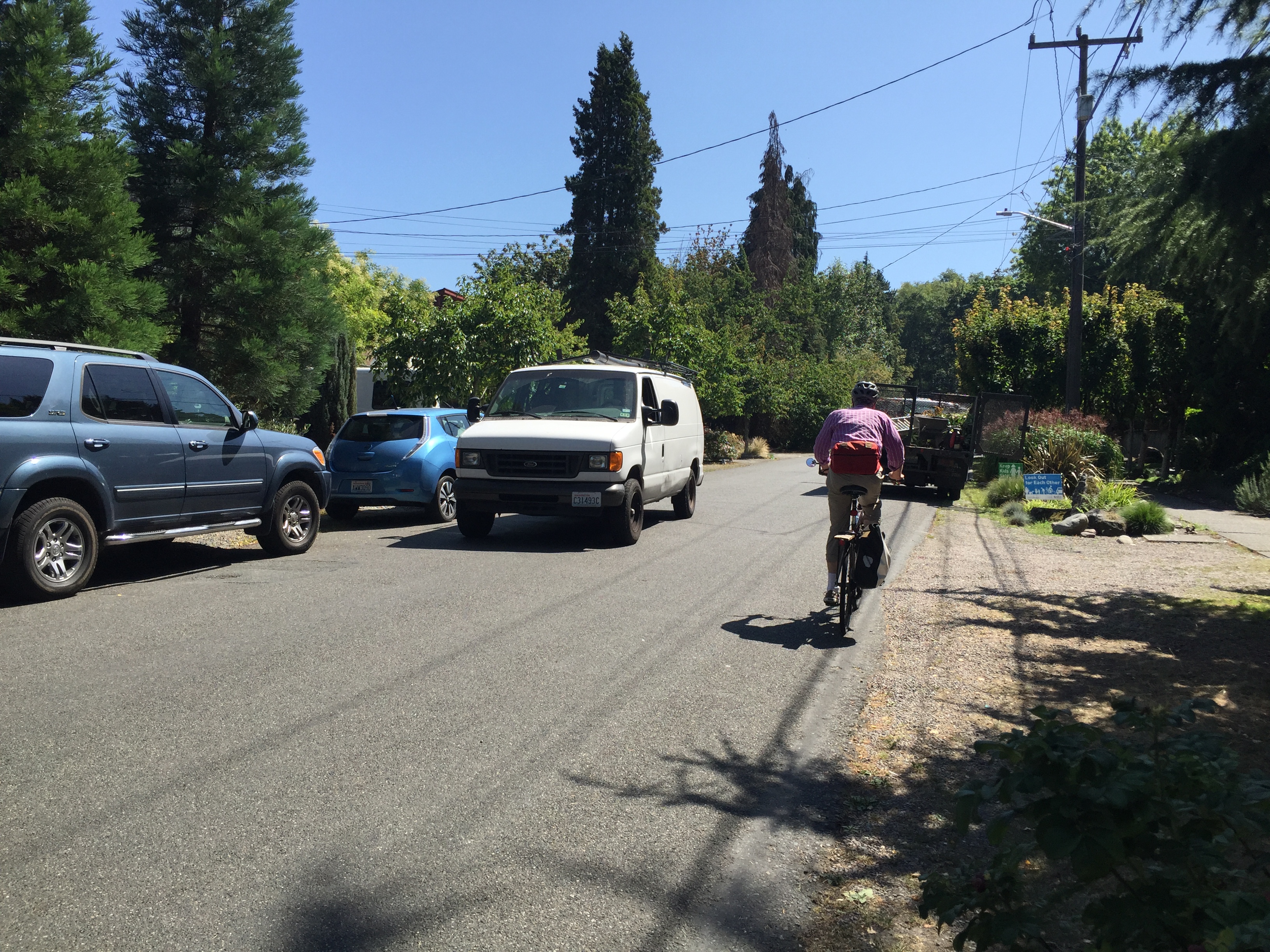 Van driving down street