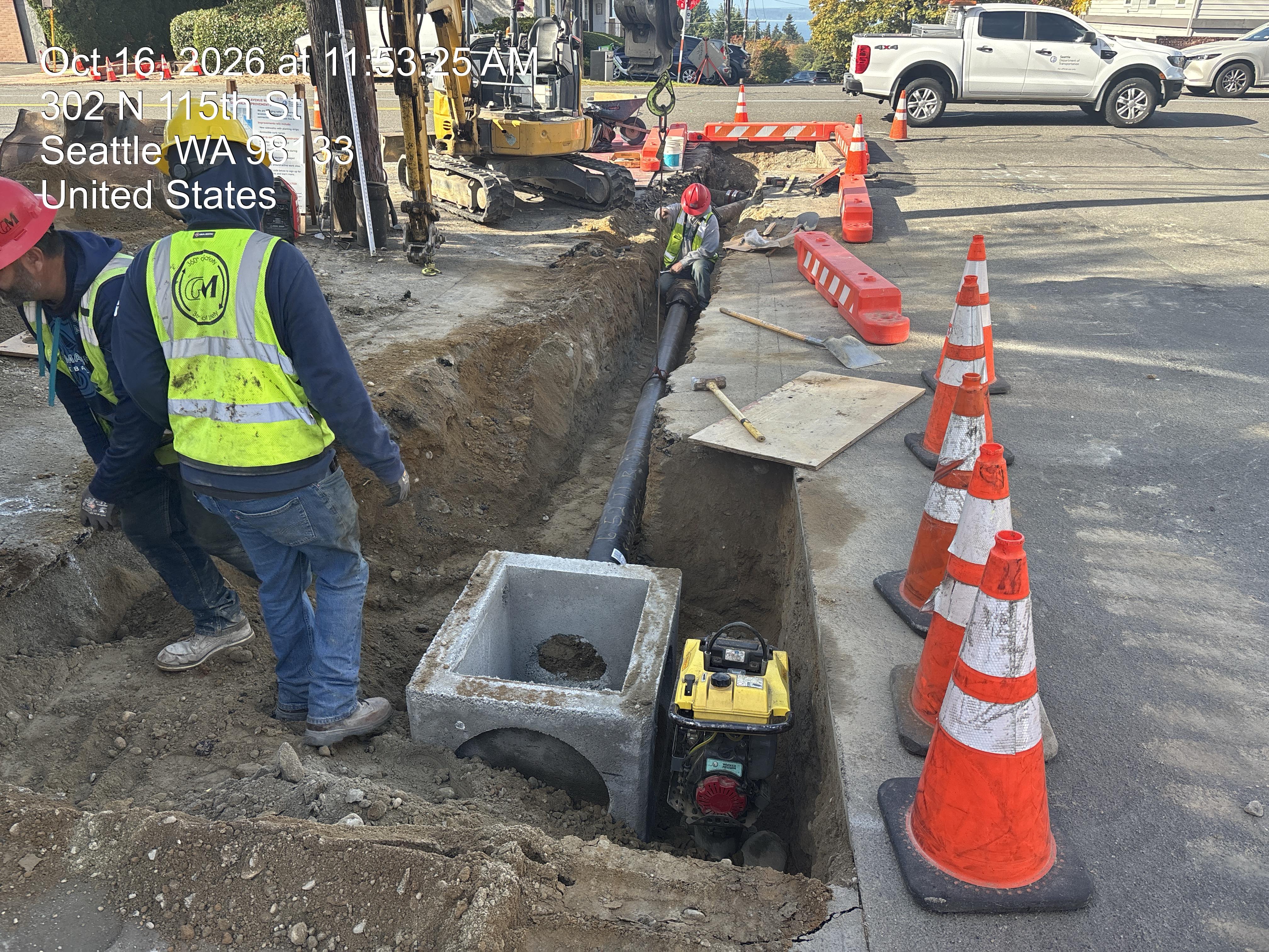 Workers clearing and preparing the roadside for construction
