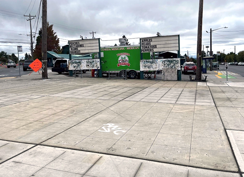 Existing plaza showing the MacPherson's Fruit Stand and empty sidewalk space in front