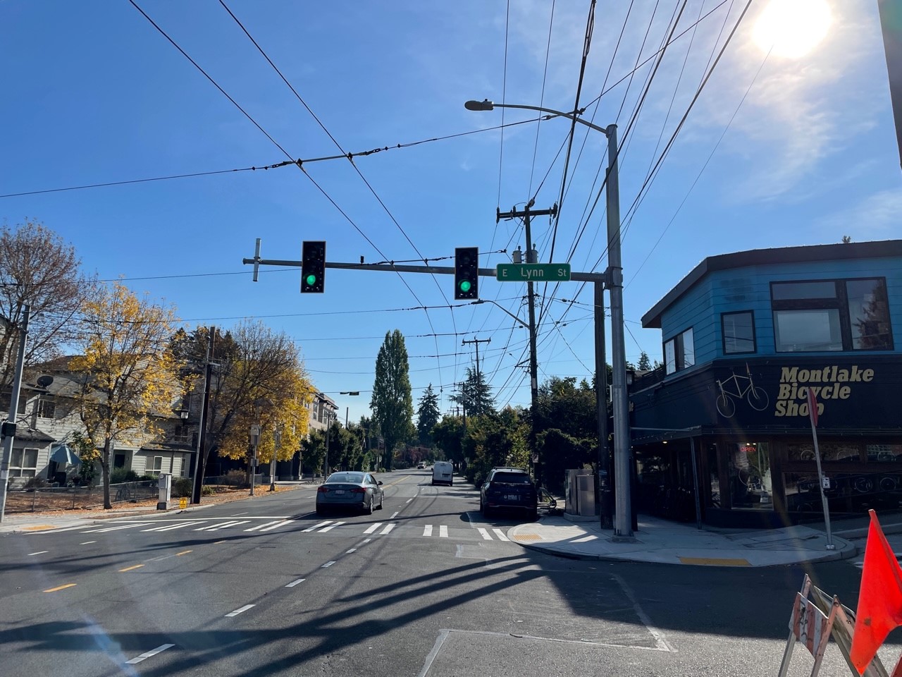 A picture of a street with a traffic signal and crosswalk. 