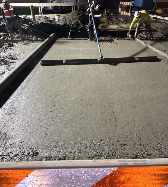 Contractor crews install new street panels on NW Leary Way, near 15th Ave NW, Friday, January 2. Image: SDOT