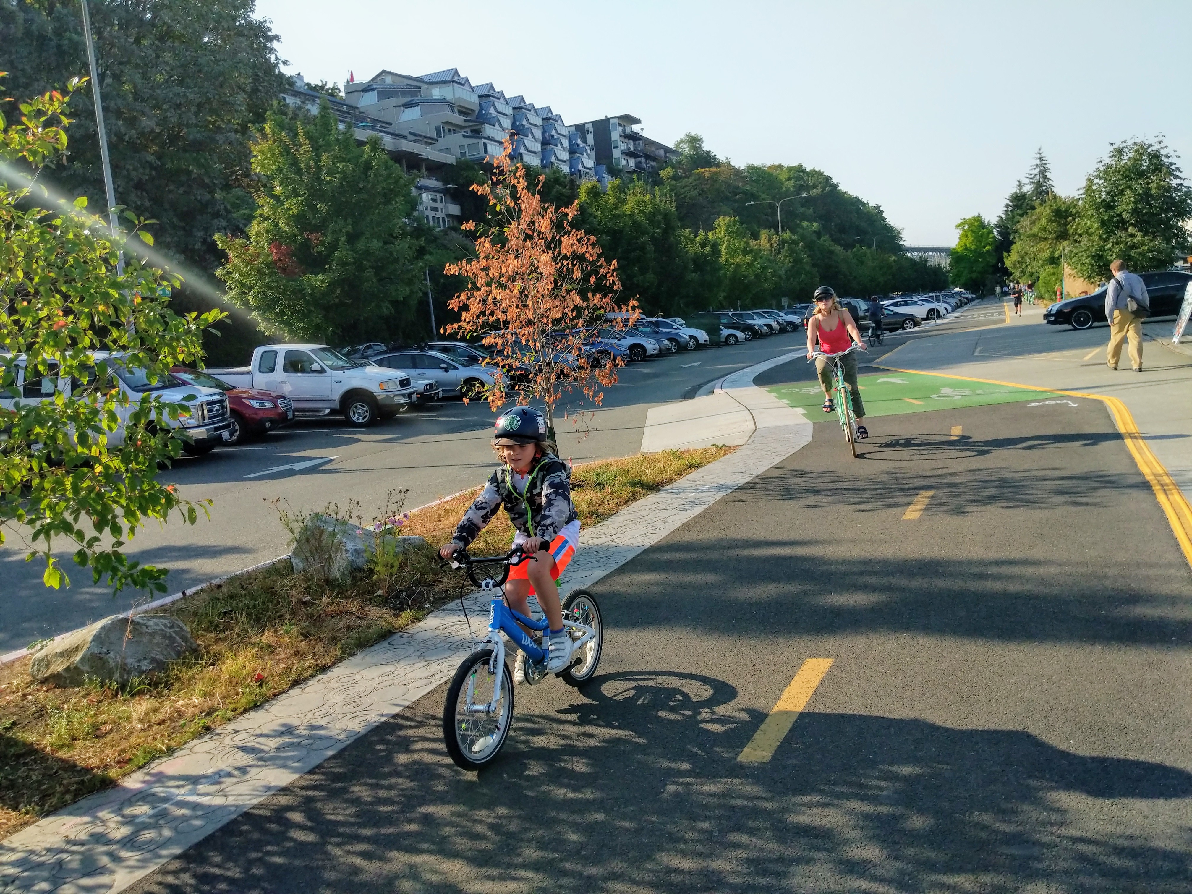 A child and adult bike along the Westlake Cycle Track in Seattle