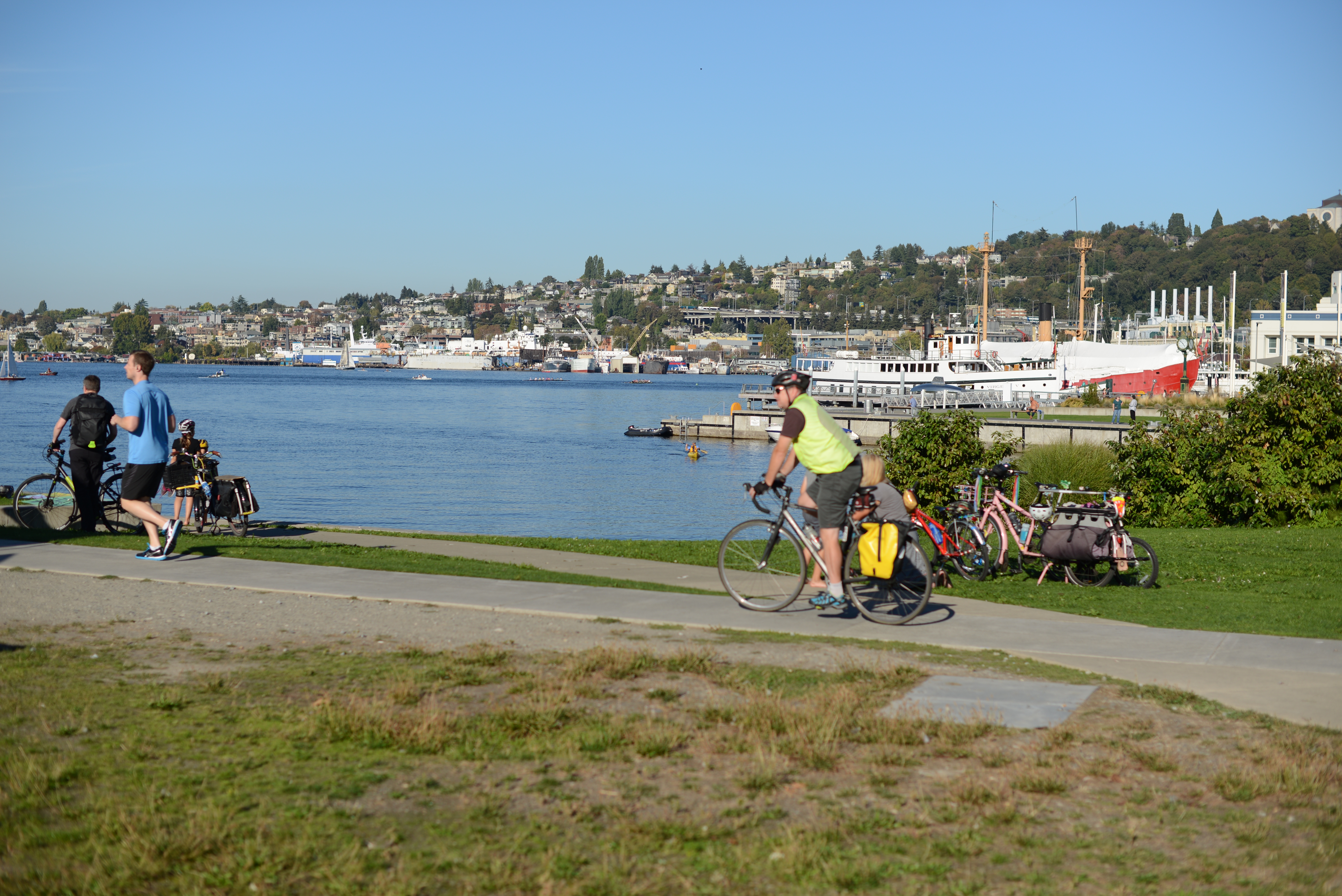 jogger and bicyclist near lake union
