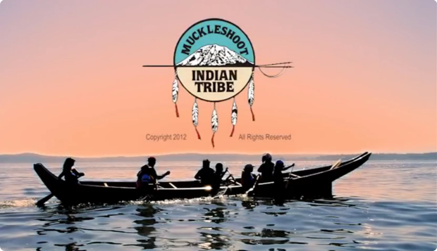 Video still showing the tribal logo and a traditional canoe in the Salish Sea.
