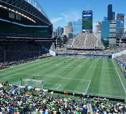 Seattle Stadium hosts a soccer match on a sunny day