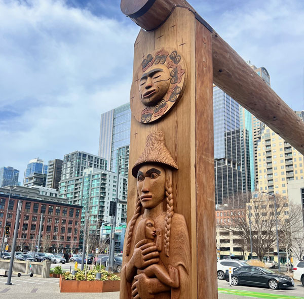 A wood carving of Chief Seattle&rsquo;s mother Sholeetsa, holding Chief Seattle as an infant