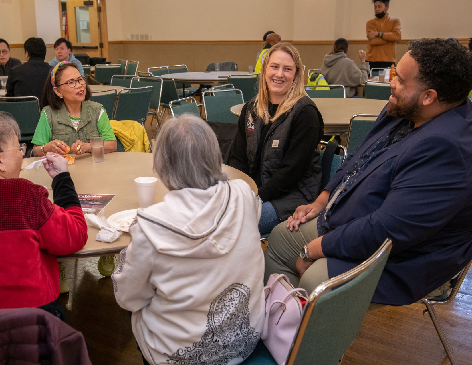Community Engagement Director Dorian Waller is talking with community members at the Filipino Community Center.