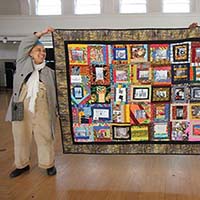 “Home of Good: A Black Seattle Storyquilt,” Storme Webber, cotton, silk and various fabrics, 96 x 65 in., 2017 