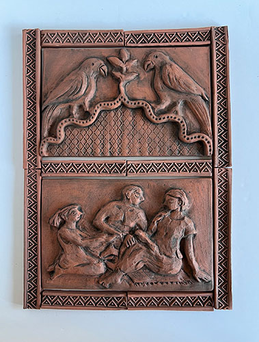 Terracotta relief of birds and three people.