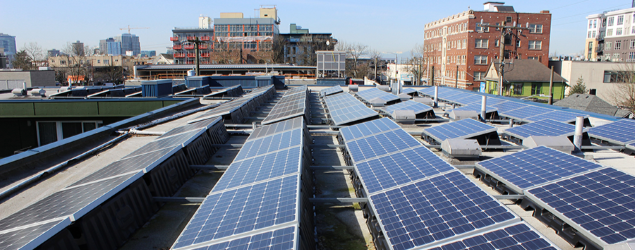 Solar panels on an urban building rooftop.