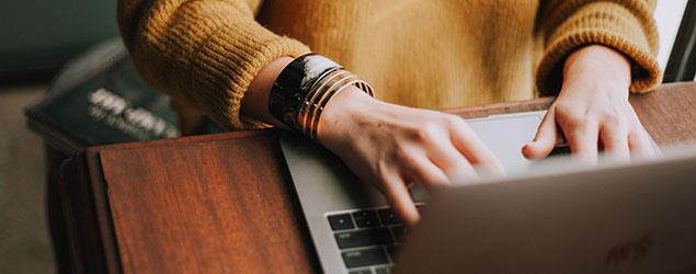 Image of a person using a laptop