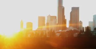 Image of Seattle skyline with a sun glare.