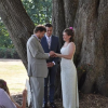 A couple exchanges vows in a wedding at Magnolia Park