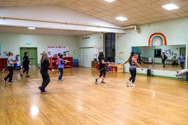 Women in an indoor exercise class in the Multi Purpose Room