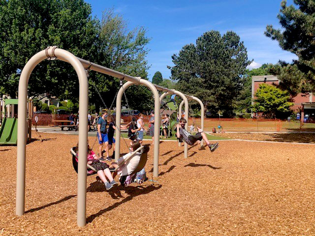Loyal Heights Playfield renovated play area with swings in foreground