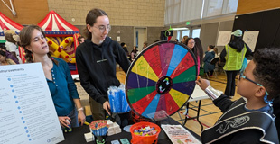 Interns at a community tabling event