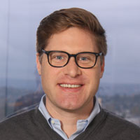 Photo of Dan Anderson with the city behind him. 