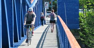 A bicyclist and walker on the Fremont Bridge