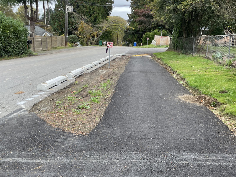 At-grade asphalt walkway