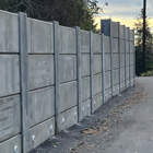 The final wall, road surface, and drainage along Perkins Lane at project completion 