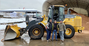 SDOT staff standing next to a snow removal truck