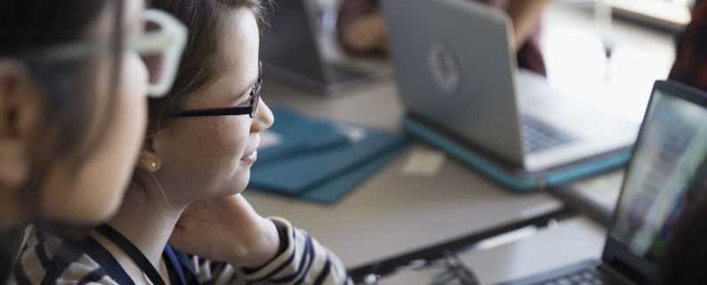 Child in front of a computer.
