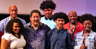 Group of teens gathered with Mayor Harrell