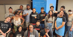 Image of Teens Gathered in front of learning screen