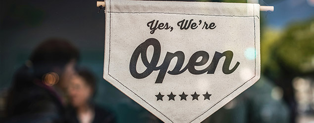 A sign says a business is open